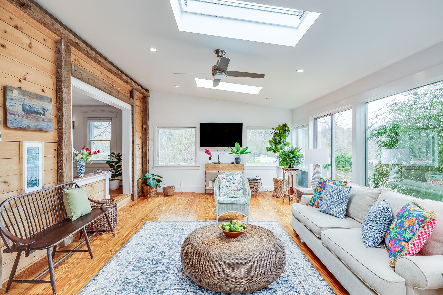 2147 Route 6 Wellfleet, MA 02667 - Photo 47 of 98 a living room with furniture a flat screen tv and a large window
