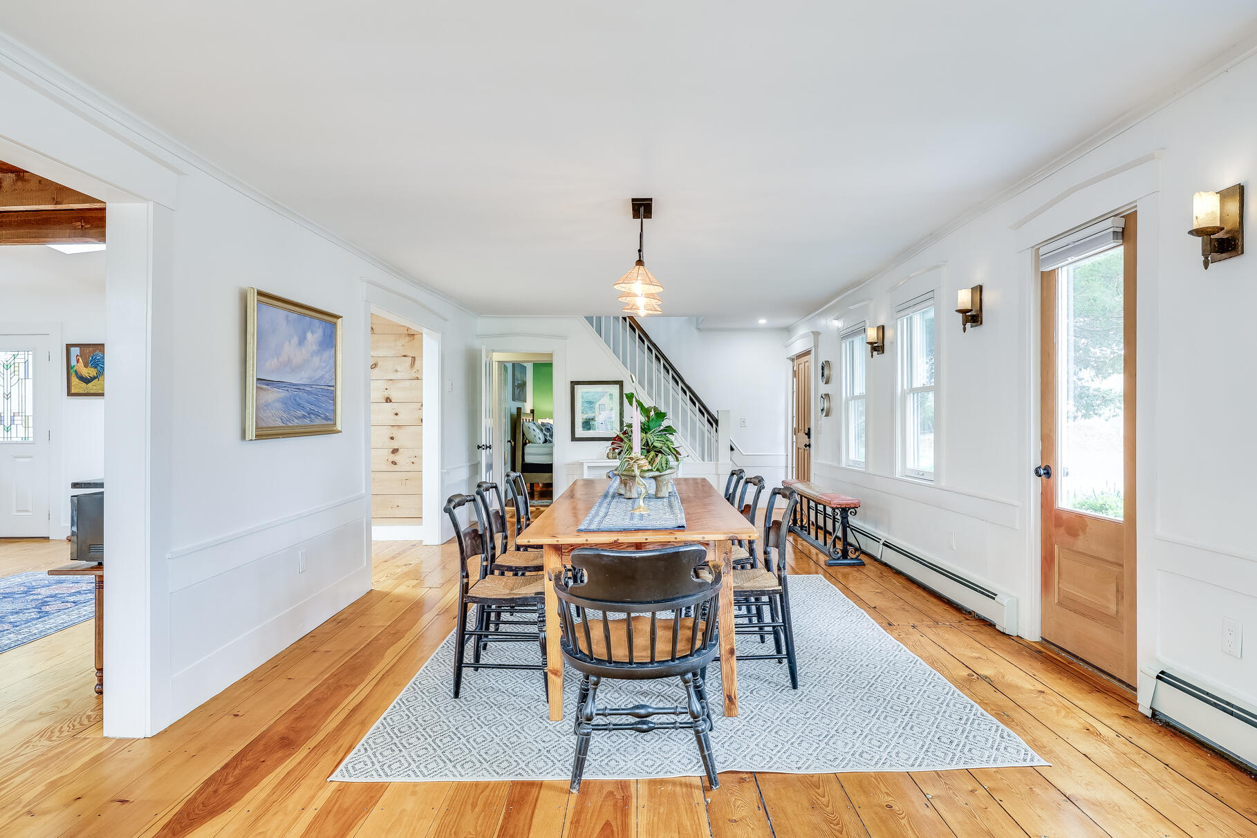 2147 Route 6 Wellfleet, MA 02667 - Photo 57 of 98 a dining room with furniture a rug and wooden floor