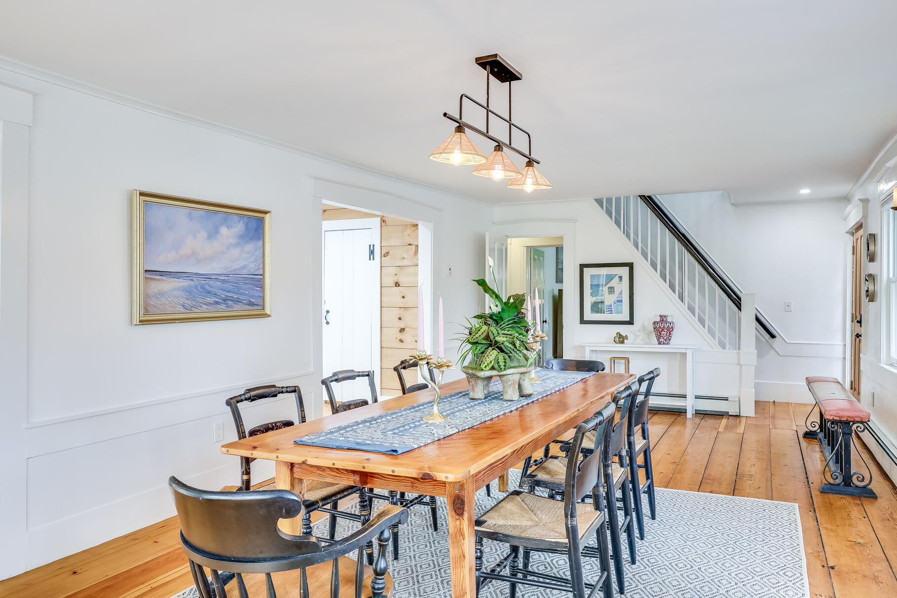 2147 Route 6 Wellfleet, MA 02667 - Photo 59 of 98 a dining room with furniture a chandelier and wooden floor
