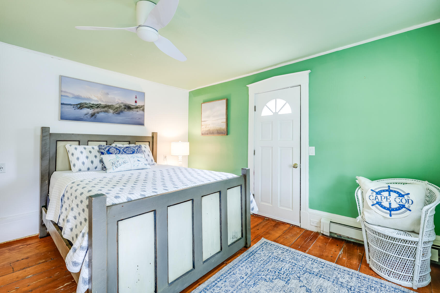 2147 Route 6 Wellfleet, MA 02667 - Photo 63 of 98 a bedroom with a bed and a painting on the wall