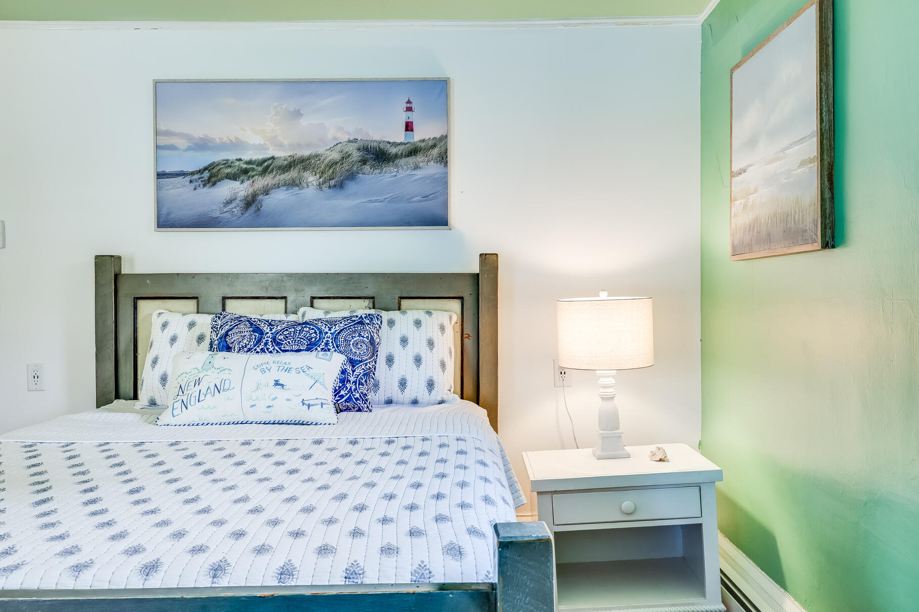 2147 Route 6 Wellfleet, MA 02667 - Photo 64 of 98 a bedroom with a bed and lamps
