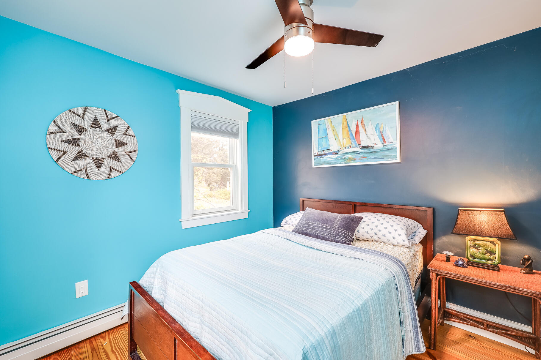 2147 Route 6 Wellfleet, MA 02667 - Photo 69 of 98 a bedroom with a bed and a chandelier