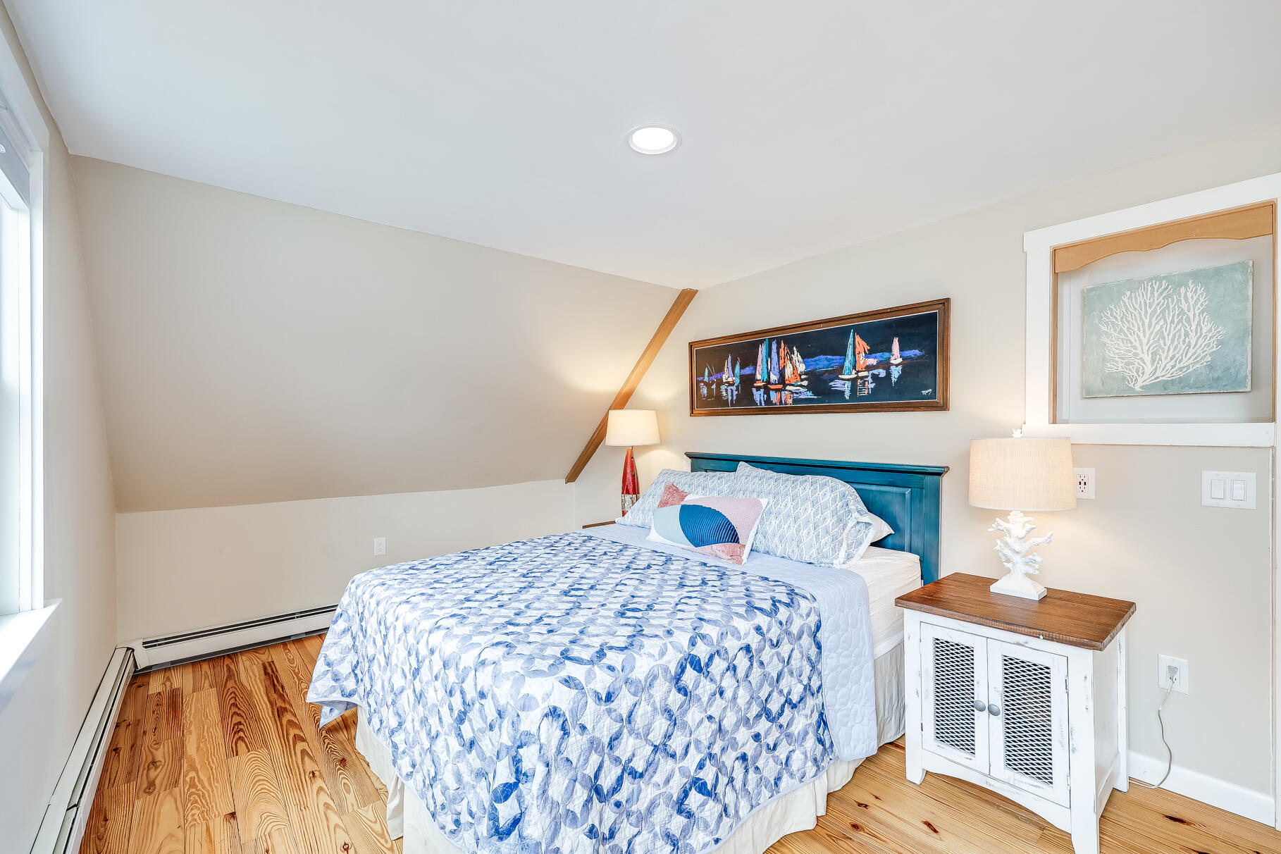 2147 Route 6 Wellfleet, MA 02667 - Photo 74 of 98 a bedroom with a bed and a painting on the wall