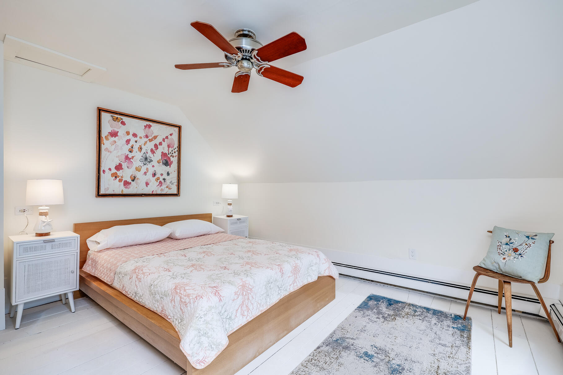 2147 Route 6 Wellfleet, MA 02667 - Photo 78 of 98 a bedroom with a bed and a painting on the wall