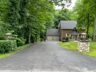 45 Willadell Road Transfer, PA 16154 - Photo 3 of 29 a front view of a house with a yard and garage