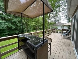 45 Willadell Road Transfer, PA 16154 - Photo 6 of 29 a view of a patio with table and chairs under an umbrella with a barbeque