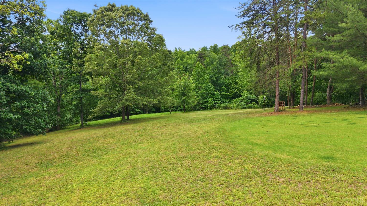 Undisclosed Address Spout Spring, VA 24593 - Photo 83 of 96 a view of a field with trees in the background