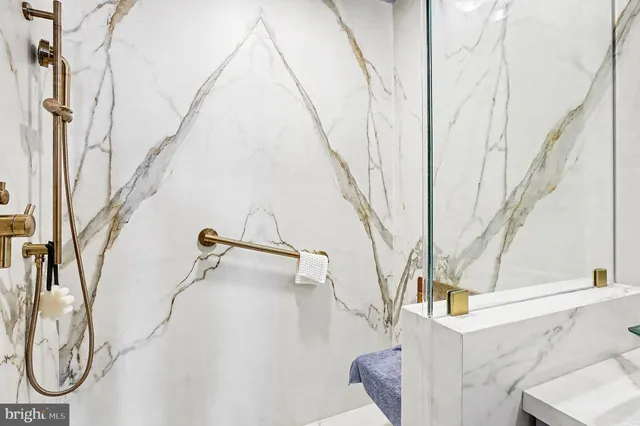 a white toilet sitting next to a bathroom sink