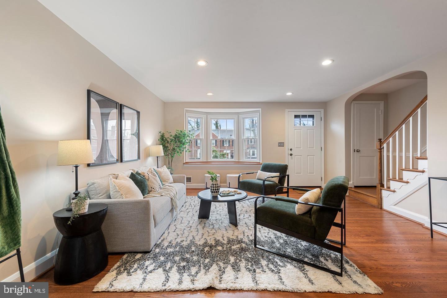 183 Stanmore Road Baltimore, MD 21212 - Photo 13 of 32 a living room with furniture wooden floor and a large window