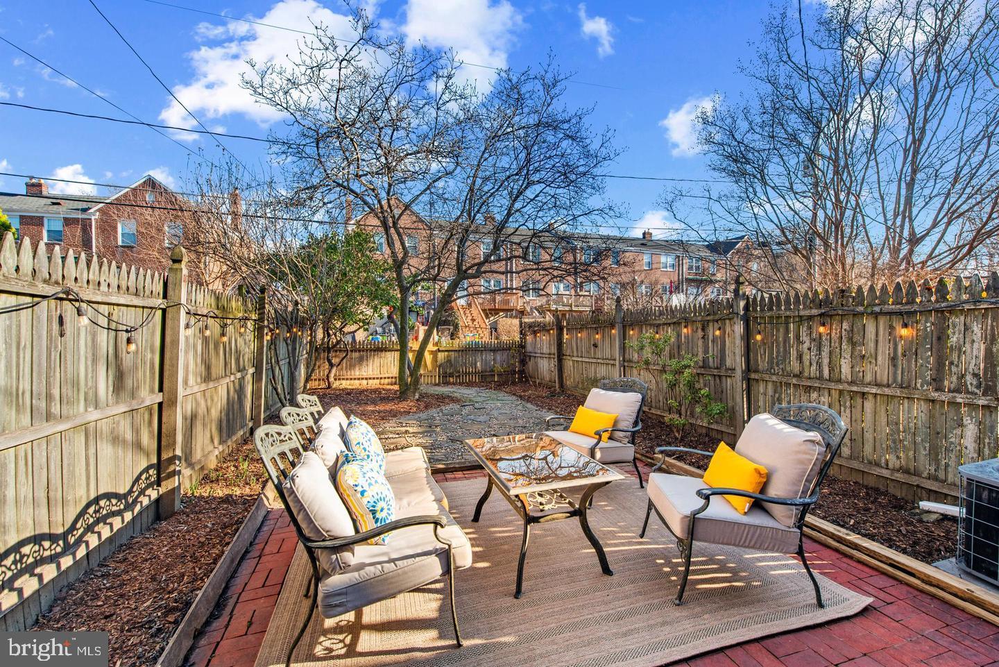183 Stanmore Road Baltimore, MD 21212 - Photo 27 of 32 a view of a lounge chairs in patio with wooden fence