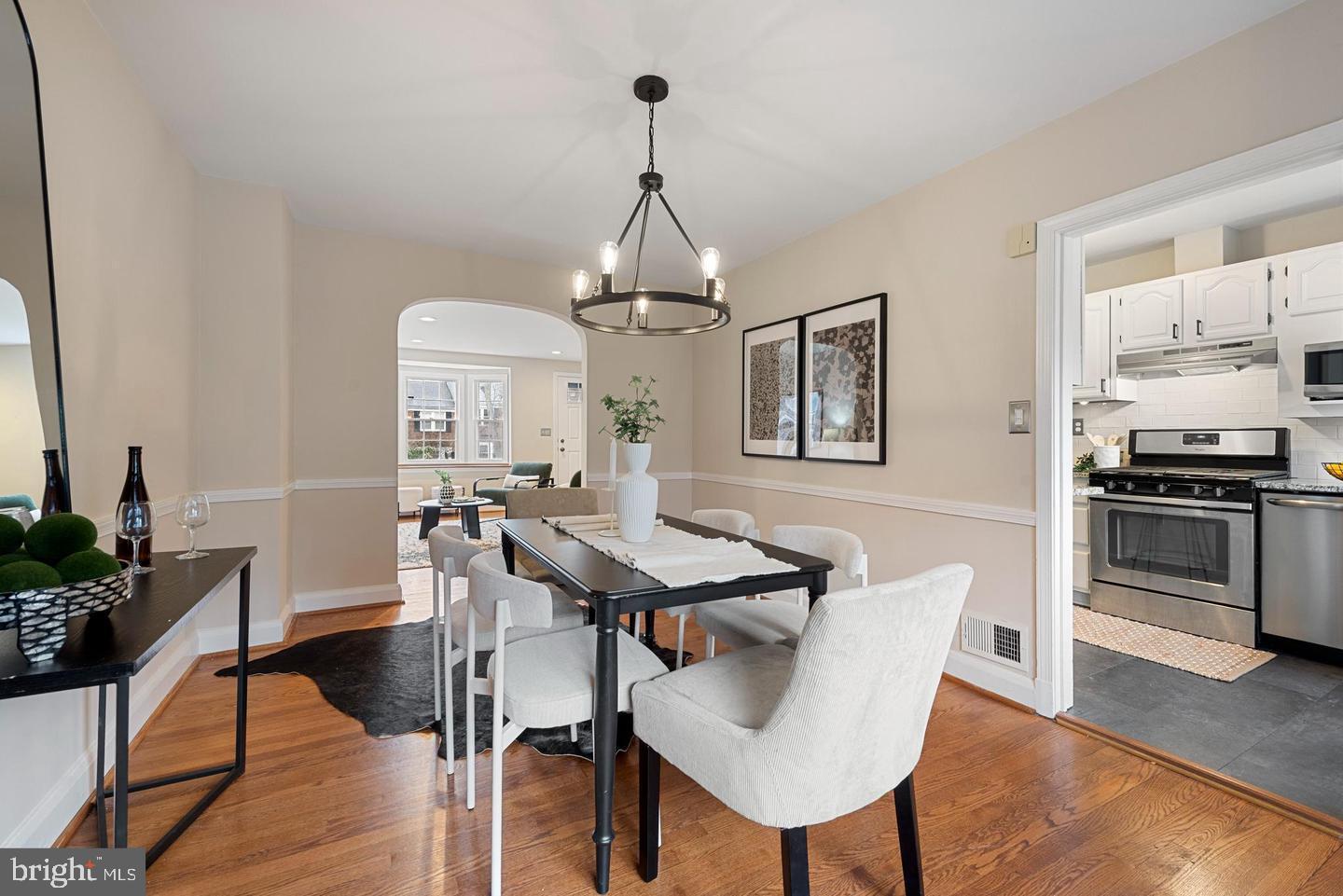 183 Stanmore Road Baltimore, MD 21212 - Photo 9 of 32 a dining room with furniture a chandelier and wooden floor