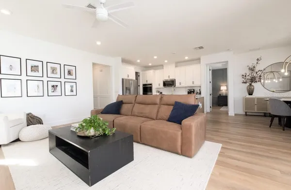 a view of a bedroom with a window and walk in closet