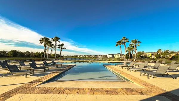 a view of a swimming pool and an outdoor space