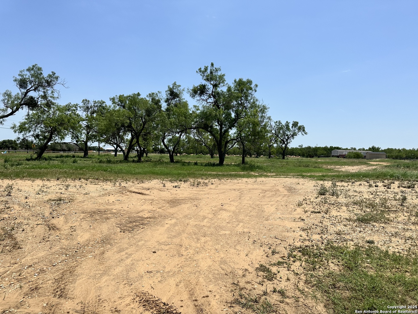 0 Las Palomas Track 2 Lytle, TX 78052 - Photo 6 of 12 a lake view with a big yard