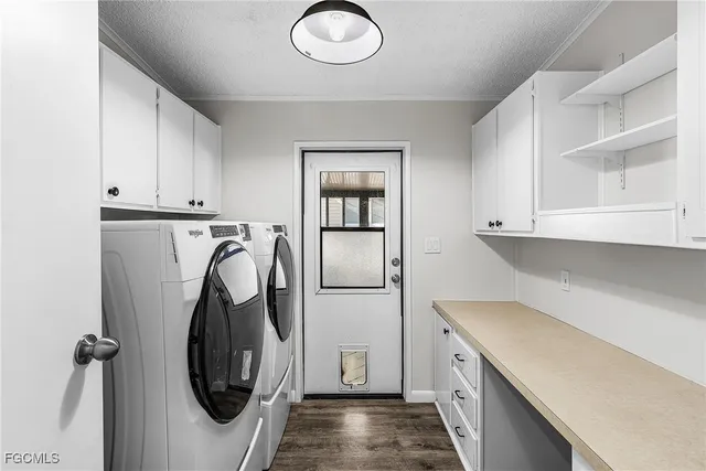 a view of cabinets and washer dryer