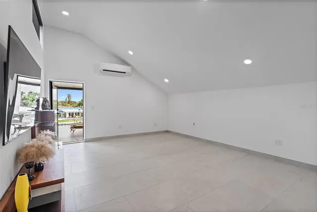 a view of a chairs and table in patio with a lake view
