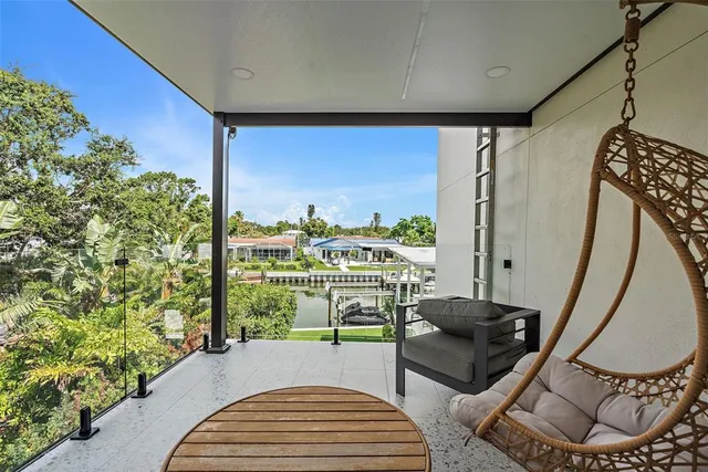 an aerial view of residential houses with outdoor space and street view