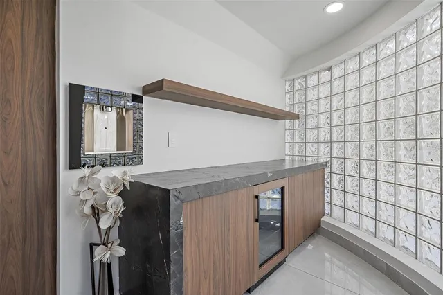 a dining room with furniture and a chandelier