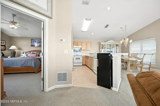 a backyard of a house with lots of green space and plants