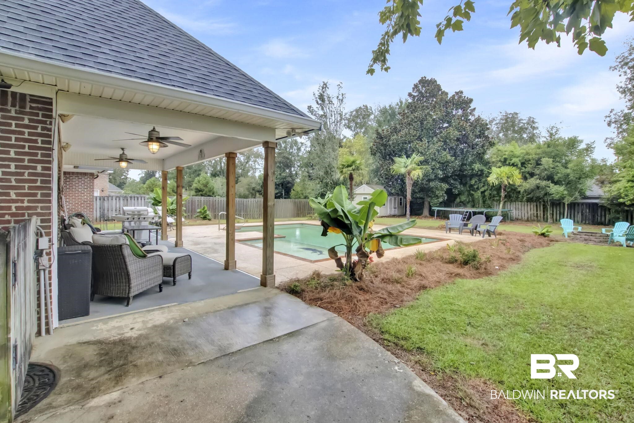 9002 Parliament Circle Daphne, AL 36526 - Photo 58 of 73 View of yard featuring a fenced in pool, ceiling fan, and a patio area