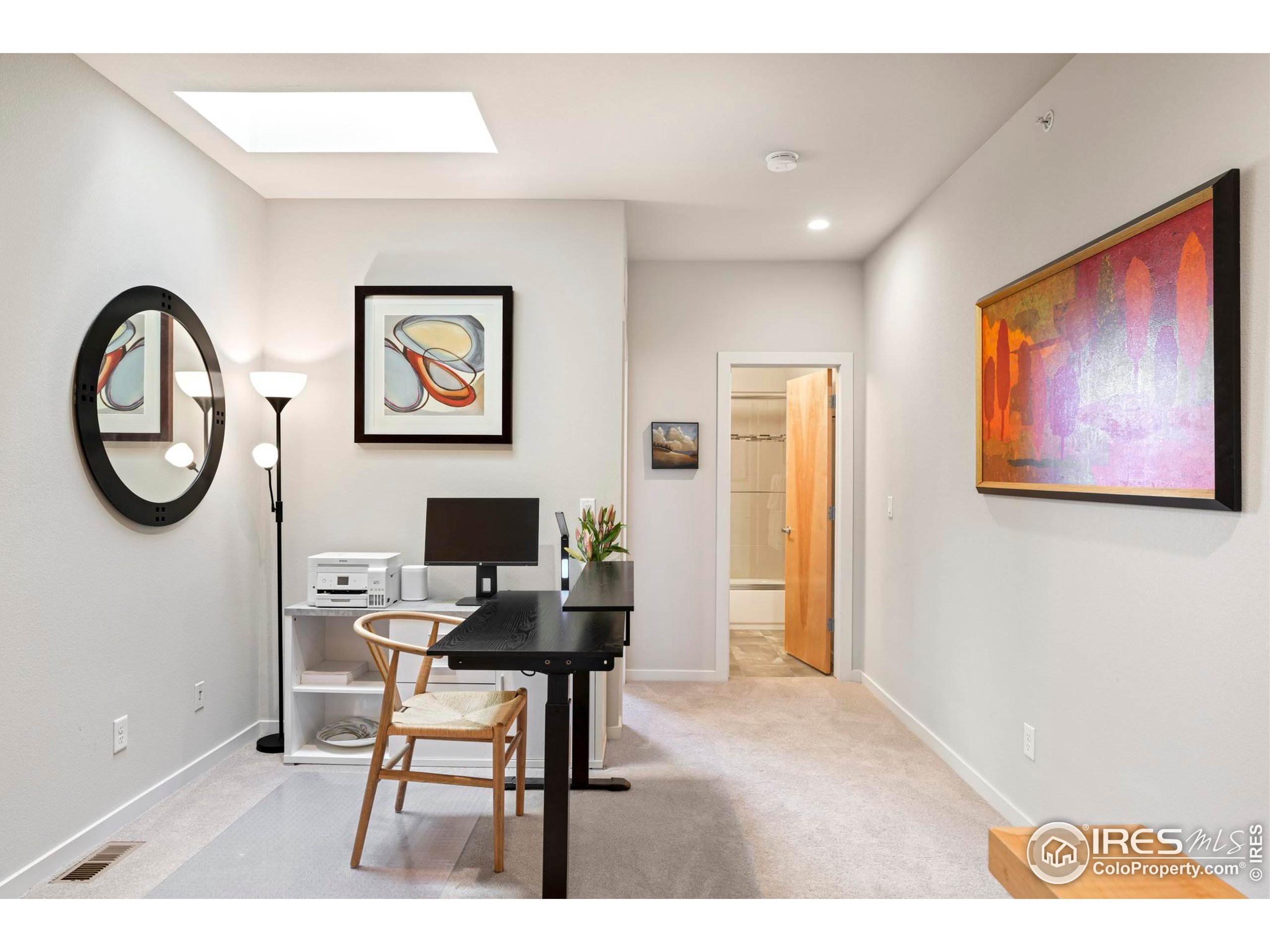 4190 Longview Lane Boulder, CO 80301 - Photo 11 of 25 a view of workspace with painting on the wall