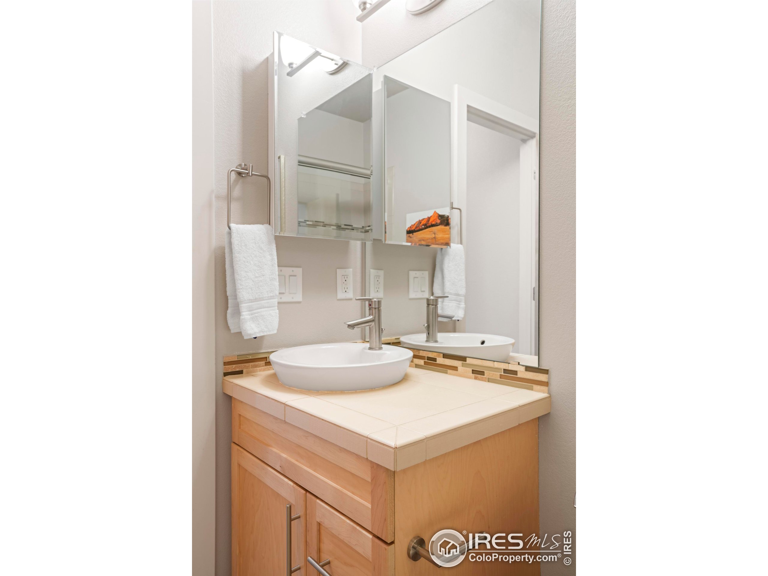 4190 Longview Lane Boulder, CO 80301 - Photo 14 of 25 a bathroom with a sink and a mirror