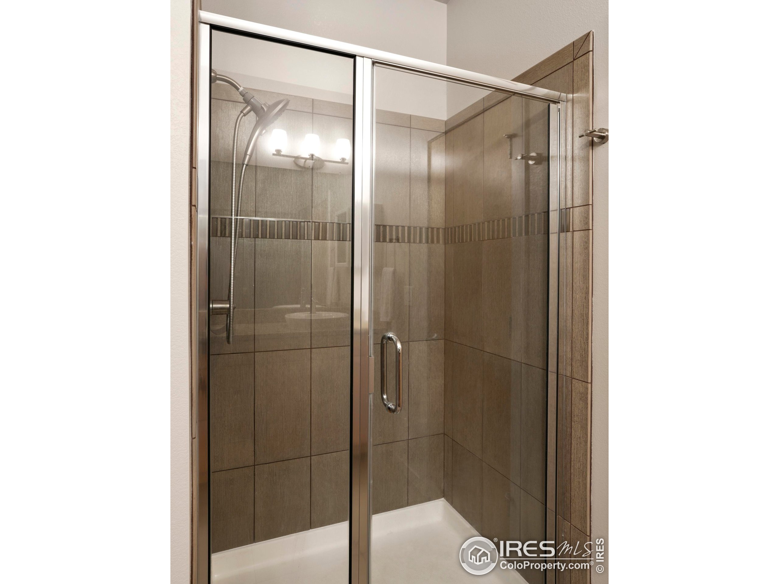 4190 Longview Lane Boulder, CO 80301 - Photo 20 of 25 a bathroom with a glass shower door