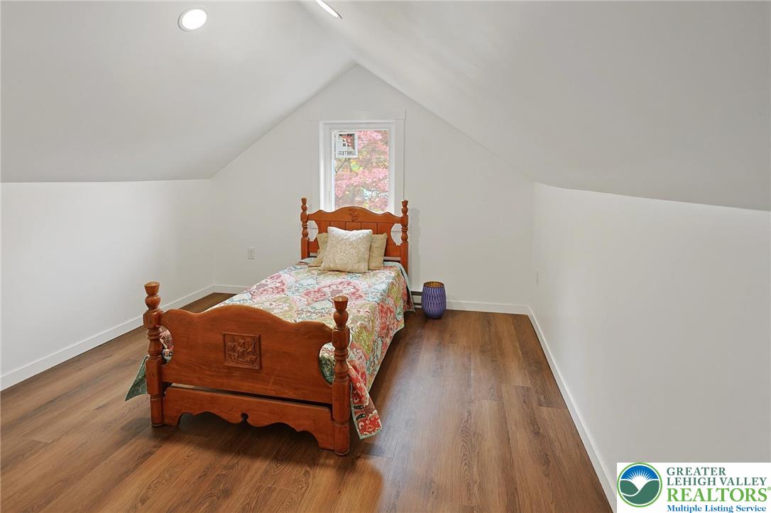121 Ben Titus Road Tamaqua, PA 18252 - Photo 37 of 48 a bedroom with a bed and wooden floor