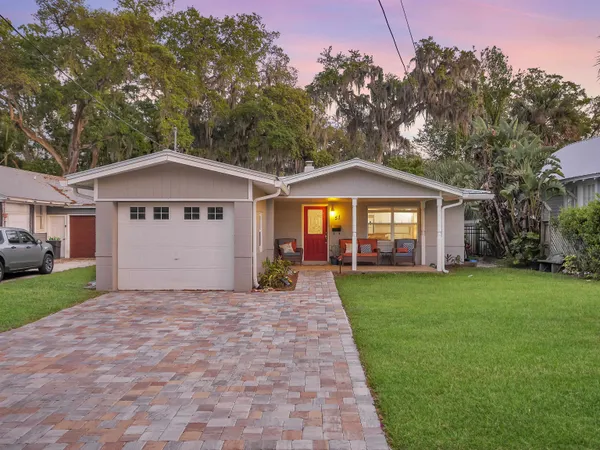 a front view of a house with yard