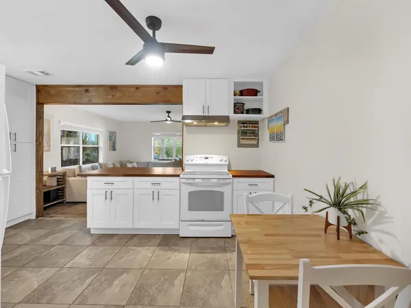 a kitchen with cabinets a sink and appliances