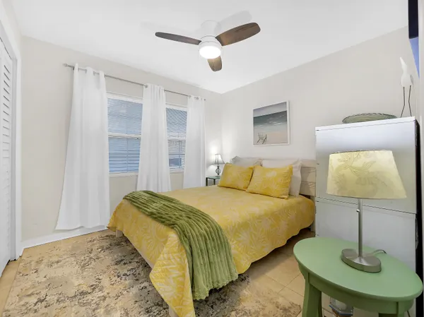 a bed room with a bed and a lamp
