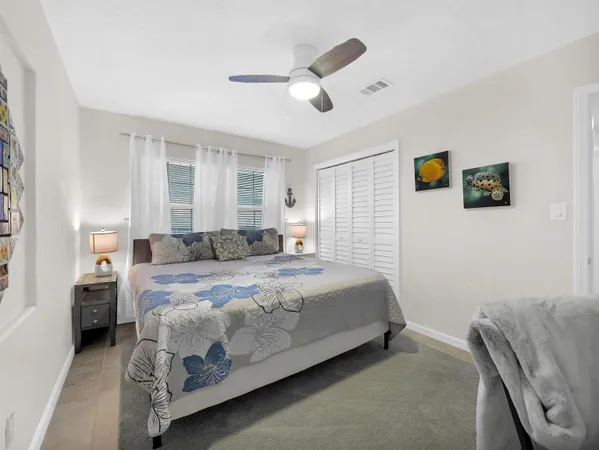 a bedroom with a bed and a desk