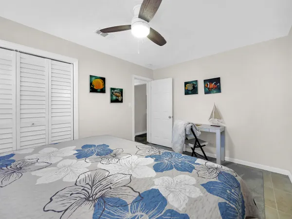 a kitchen with stainless steel appliances a white stove top oven a sink and a refrigerator