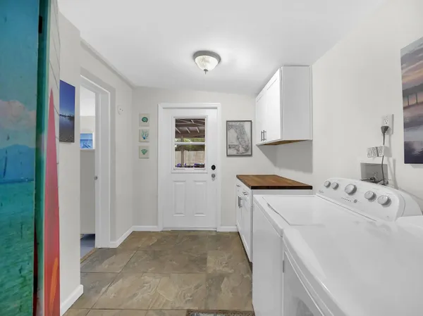 a utility room with dryer and washer