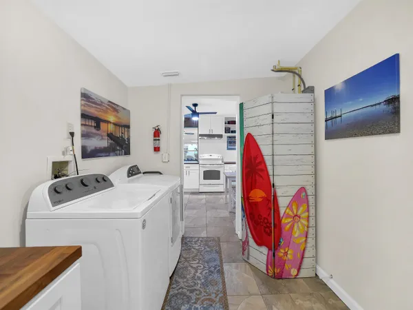 a view of a chairs and table in kitchen