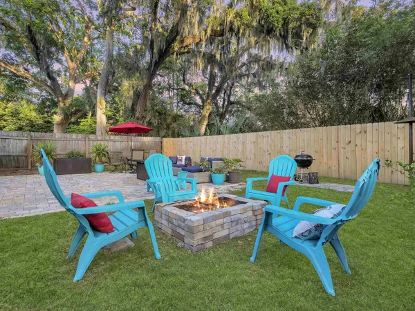 a view of a backyard with sitting area