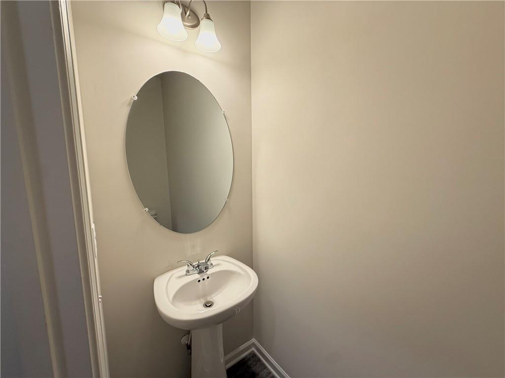 276 Whitetail Circle Canton, GA 30115 - Photo 17 of 40 a bathroom with a sink and a mirror