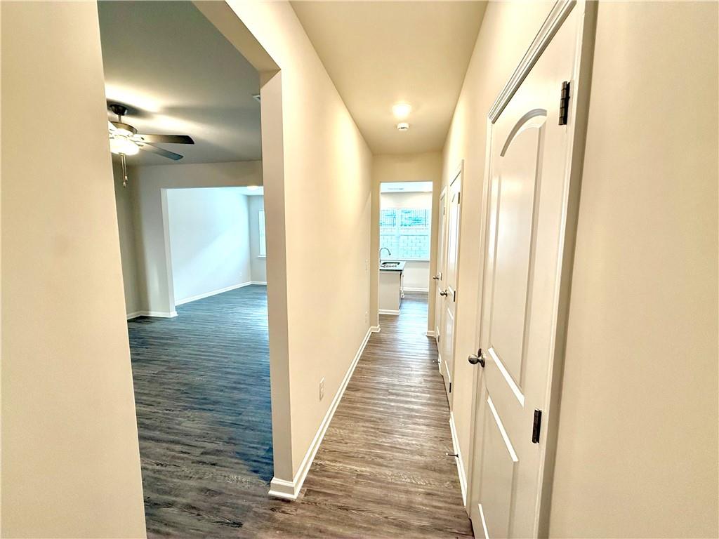 276 Whitetail Circle Canton, GA 30115 - Photo 18 of 40 a view of a hallway with wooden floor