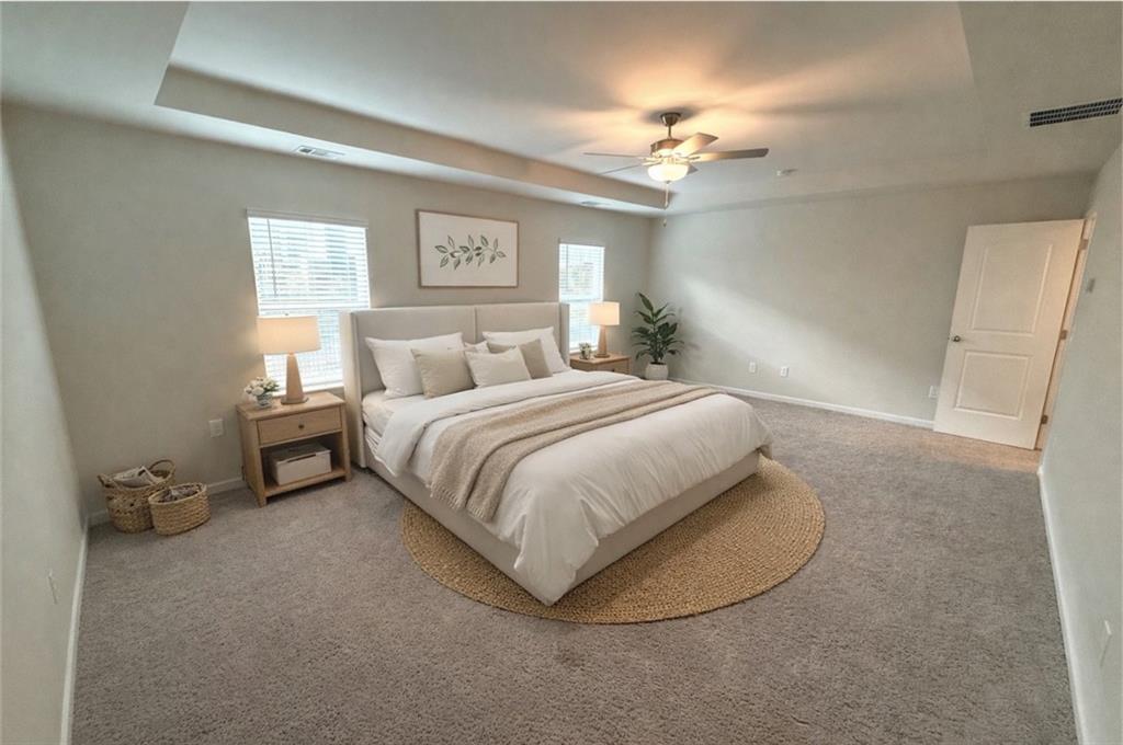 276 Whitetail Circle Canton, GA 30115 - Photo 20 of 40 a bedroom with a bed and a chandelier