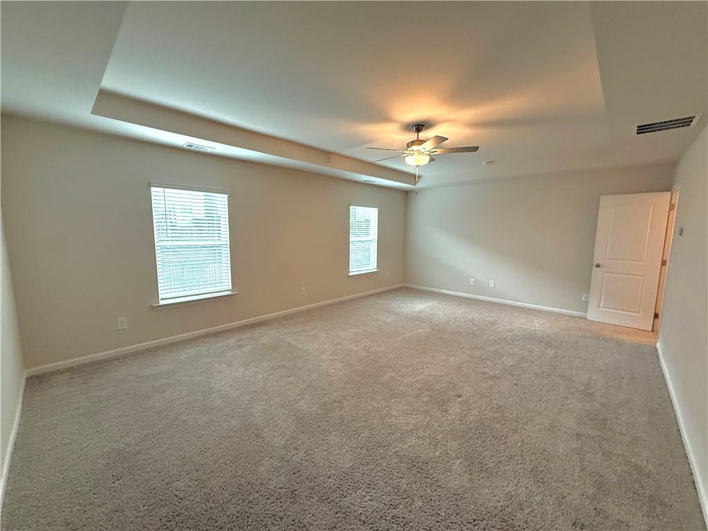 276 Whitetail Circle Canton, GA 30115 - Photo 27 of 40 an empty room with windows and fan