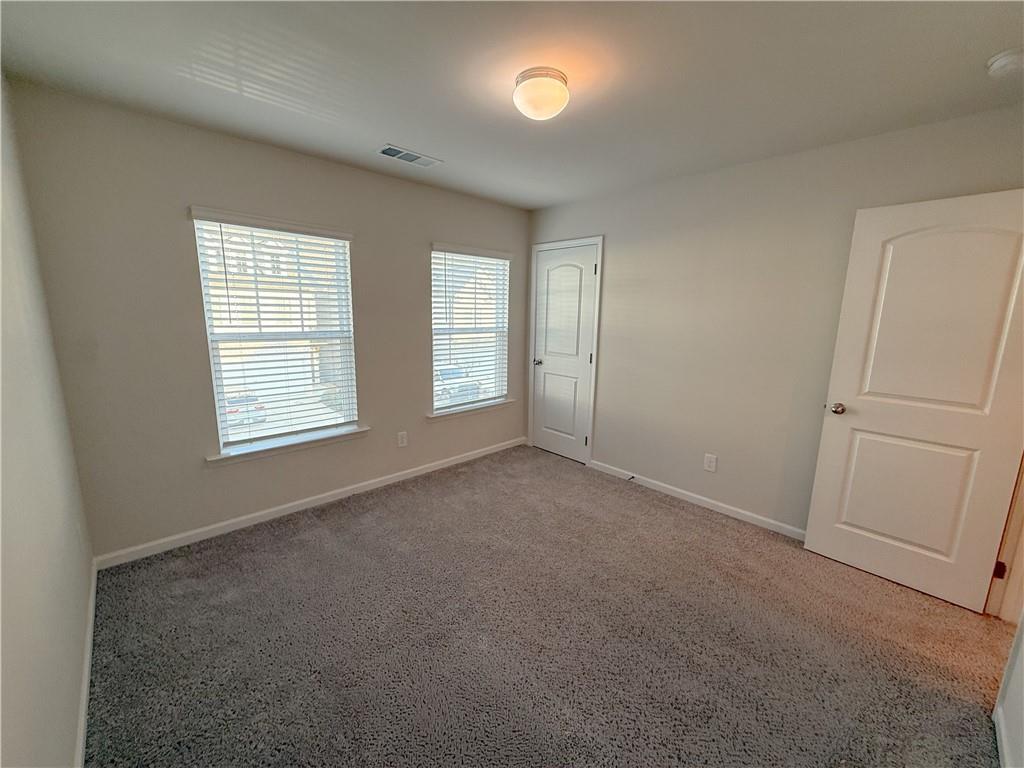 276 Whitetail Circle Canton, GA 30115 - Photo 32 of 40 an empty room with windows