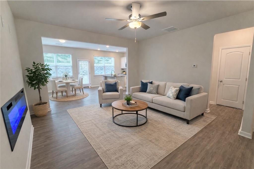 276 Whitetail Circle Canton, GA 30115 - Photo 5 of 40 a living room with furniture potted plant and a large window