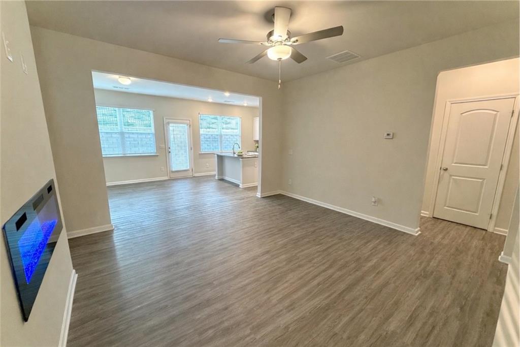 276 Whitetail Circle Canton, GA 30115 - Photo 8 of 40 wooden floor in an empty room with a window