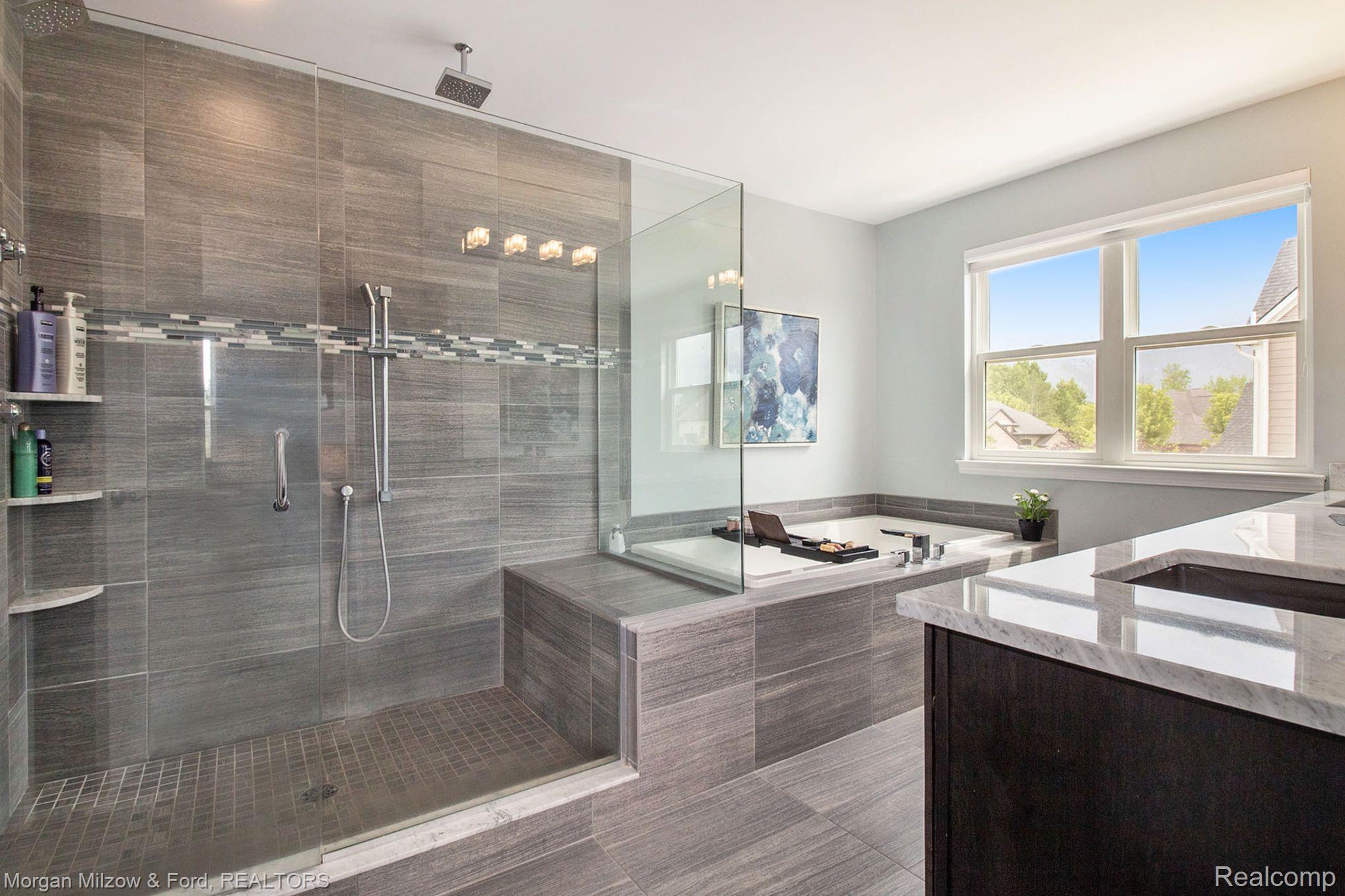 4557 Oakhurst Ridge Road Clarkston, MI 48348 - Photo 18 of 42 Stunning primary bath w/tub, Euro shower & 2 sinks