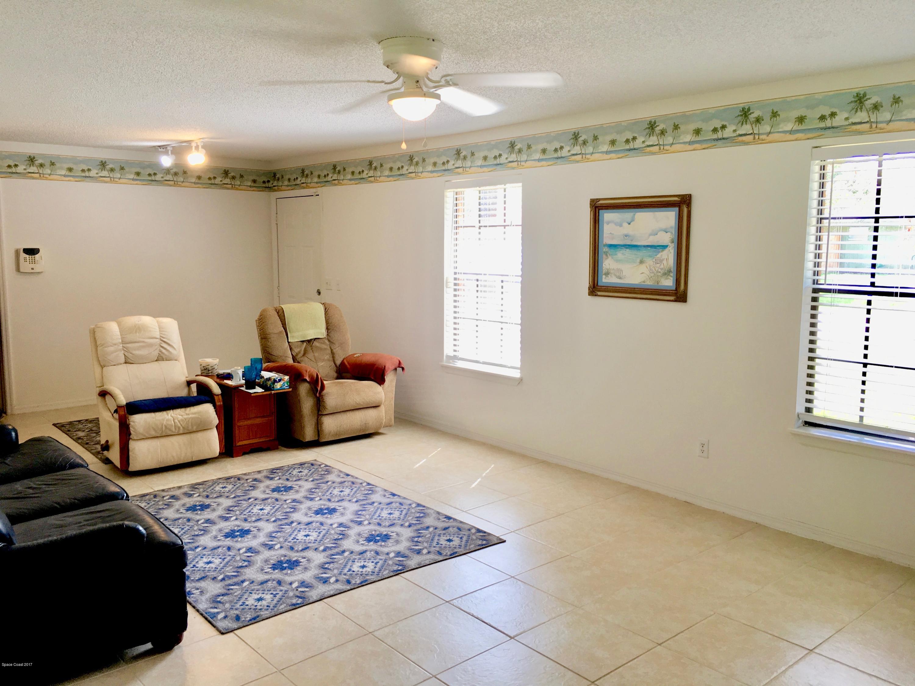 853 Furth Road Northwest Palm Bay, FL 32907 - Photo 11 of 29 a living room with furniture and a window