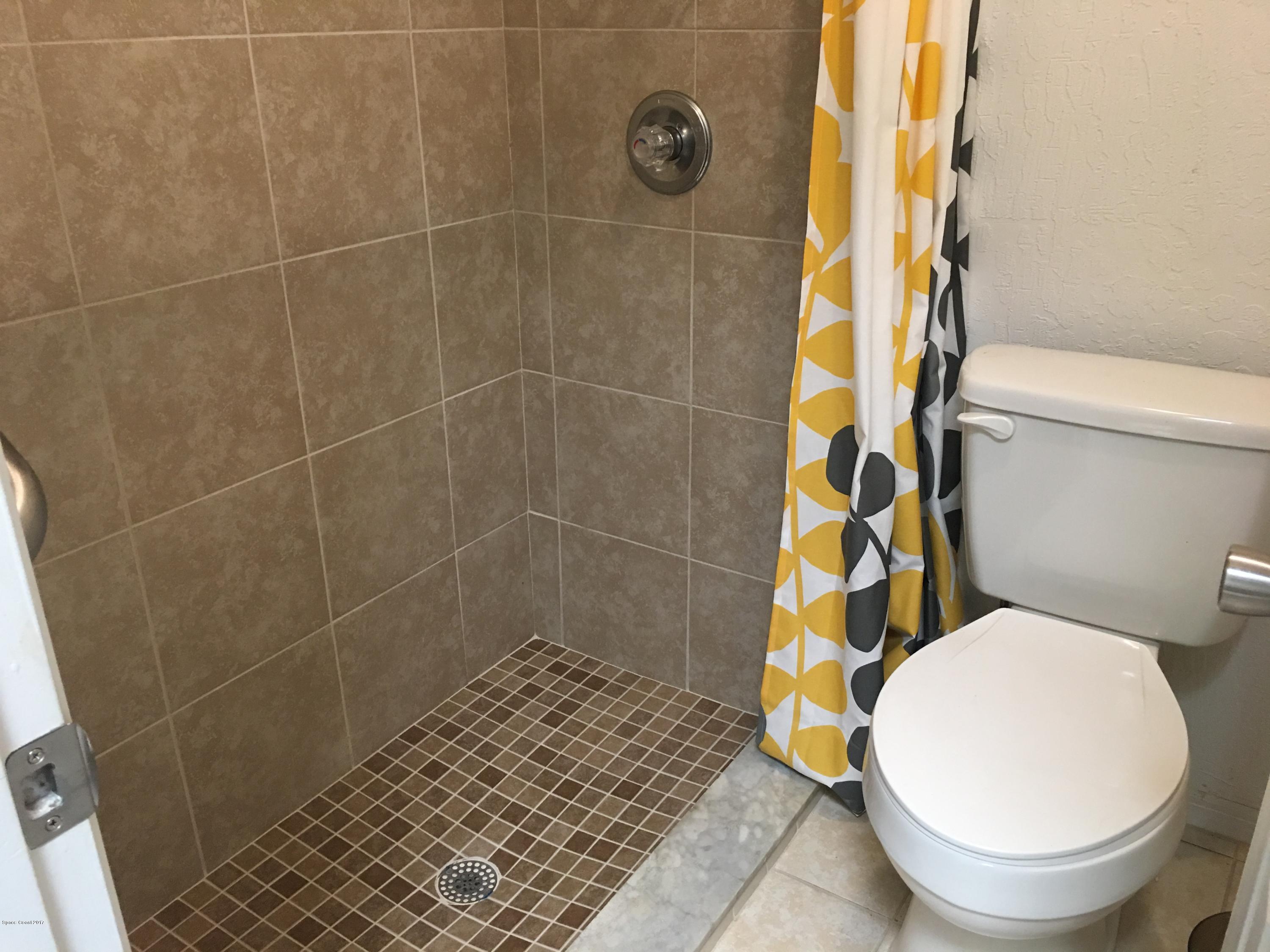 853 Furth Road Northwest Palm Bay, FL 32907 - Photo 15 of 29 a bathroom with a toilet and a shower