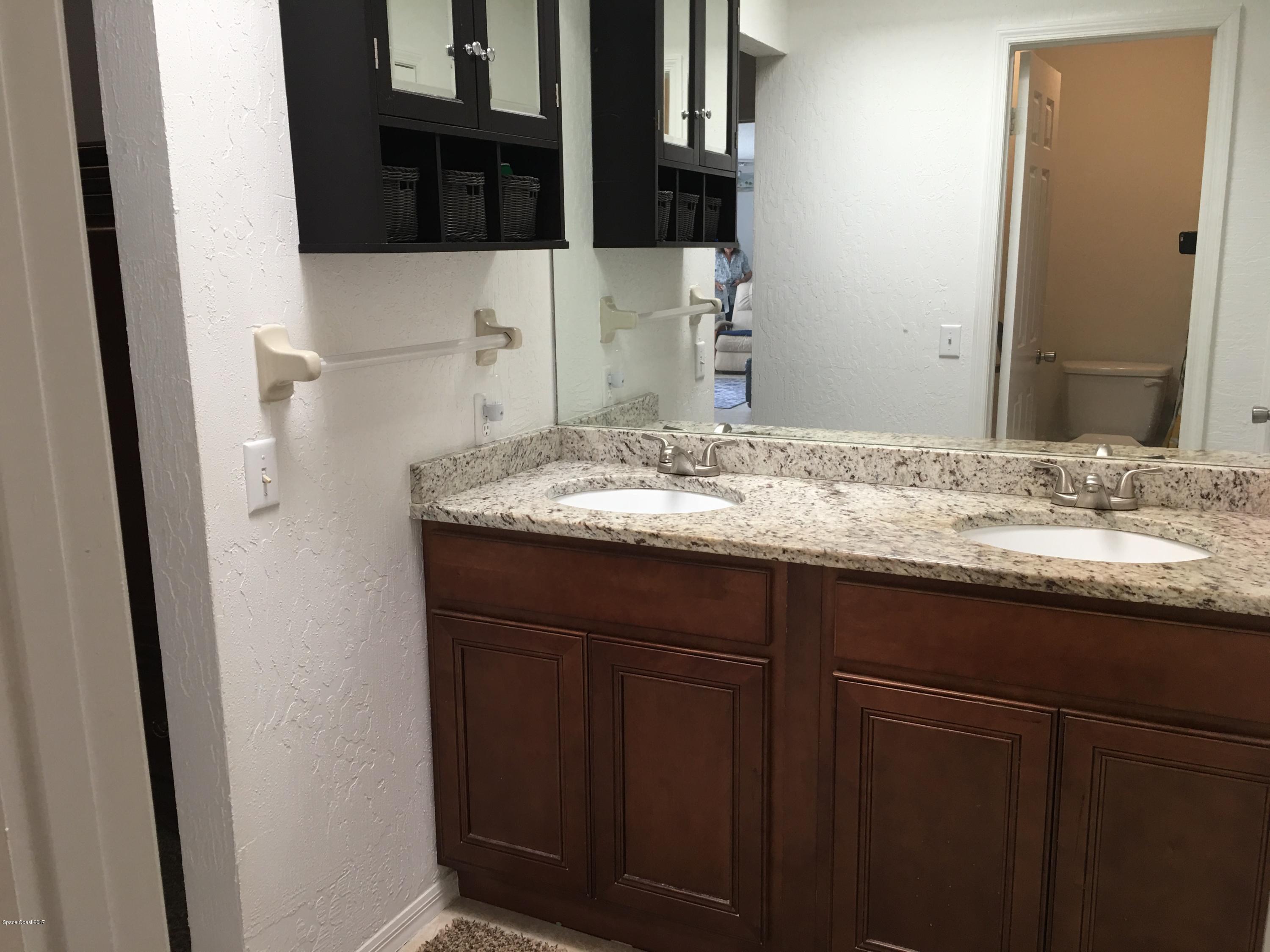 853 Furth Road Northwest Palm Bay, FL 32907 - Photo 19 of 29 a bathroom with a sink and a mirror