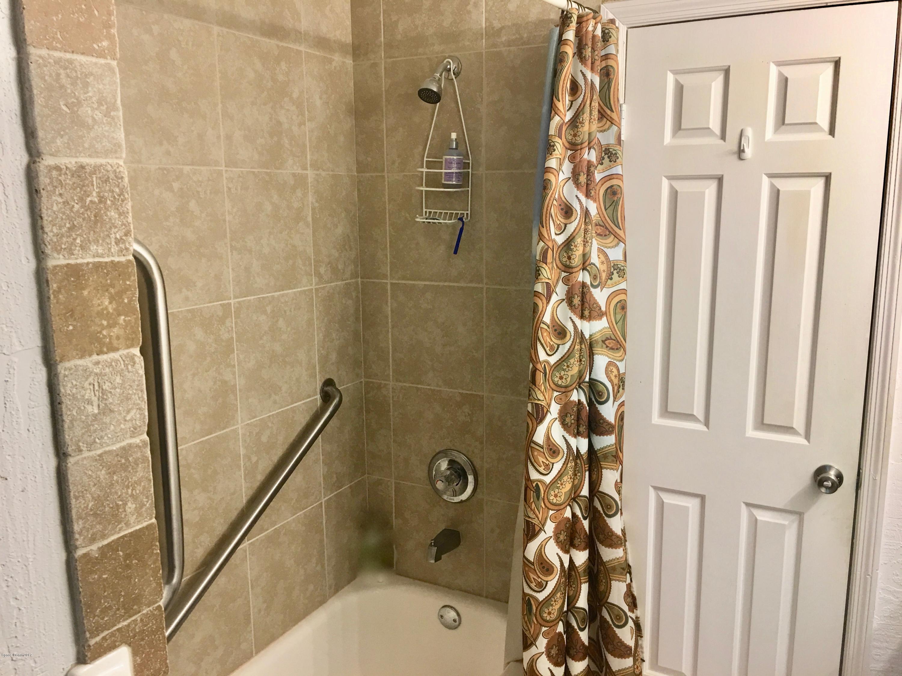 853 Furth Road Northwest Palm Bay, FL 32907 - Photo 21 of 29 a bathroom with a shower toilet and sink