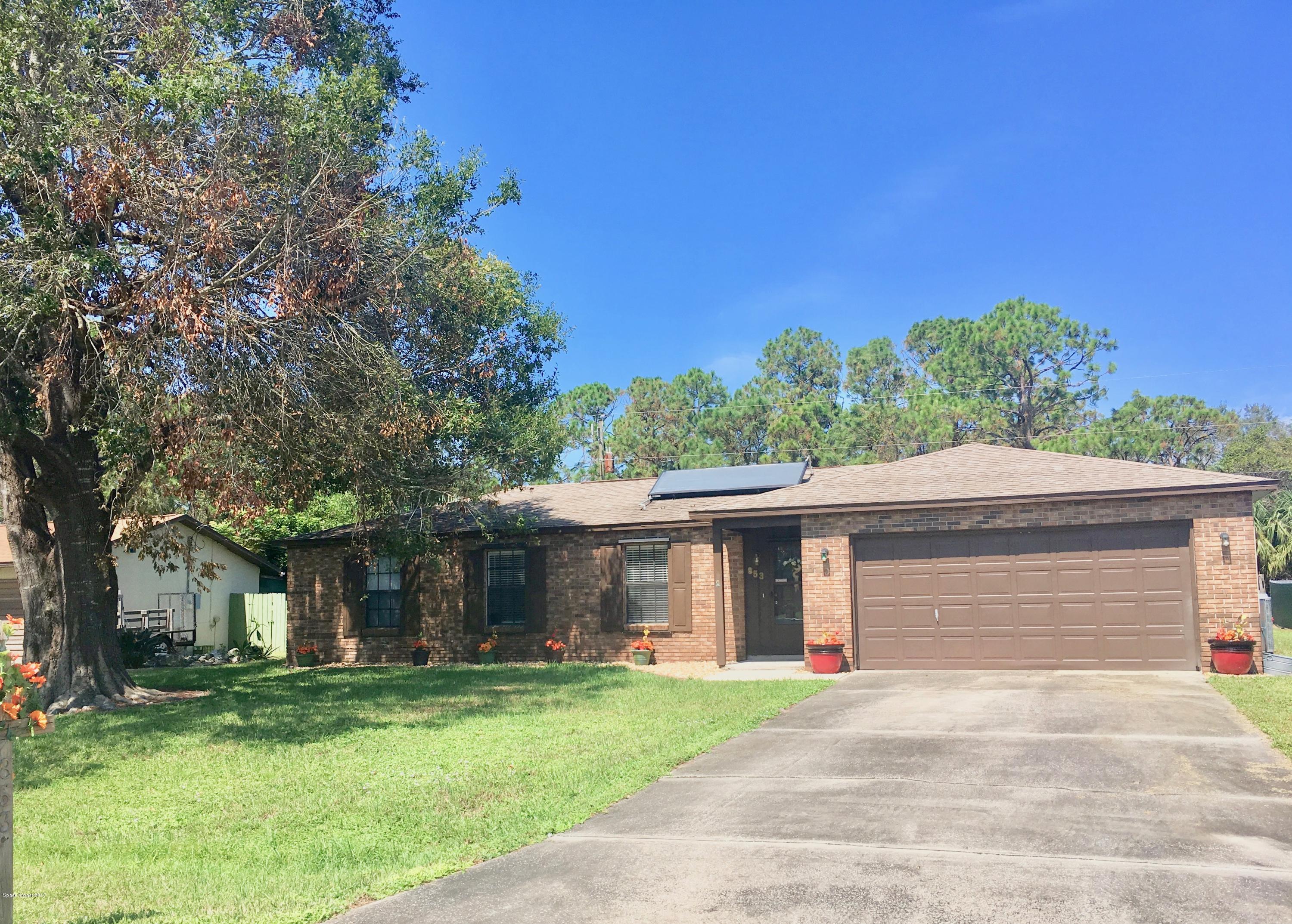 853 Furth Road Northwest Palm Bay, FL 32907 - Photo 29 of 29 front view of a house with a yard