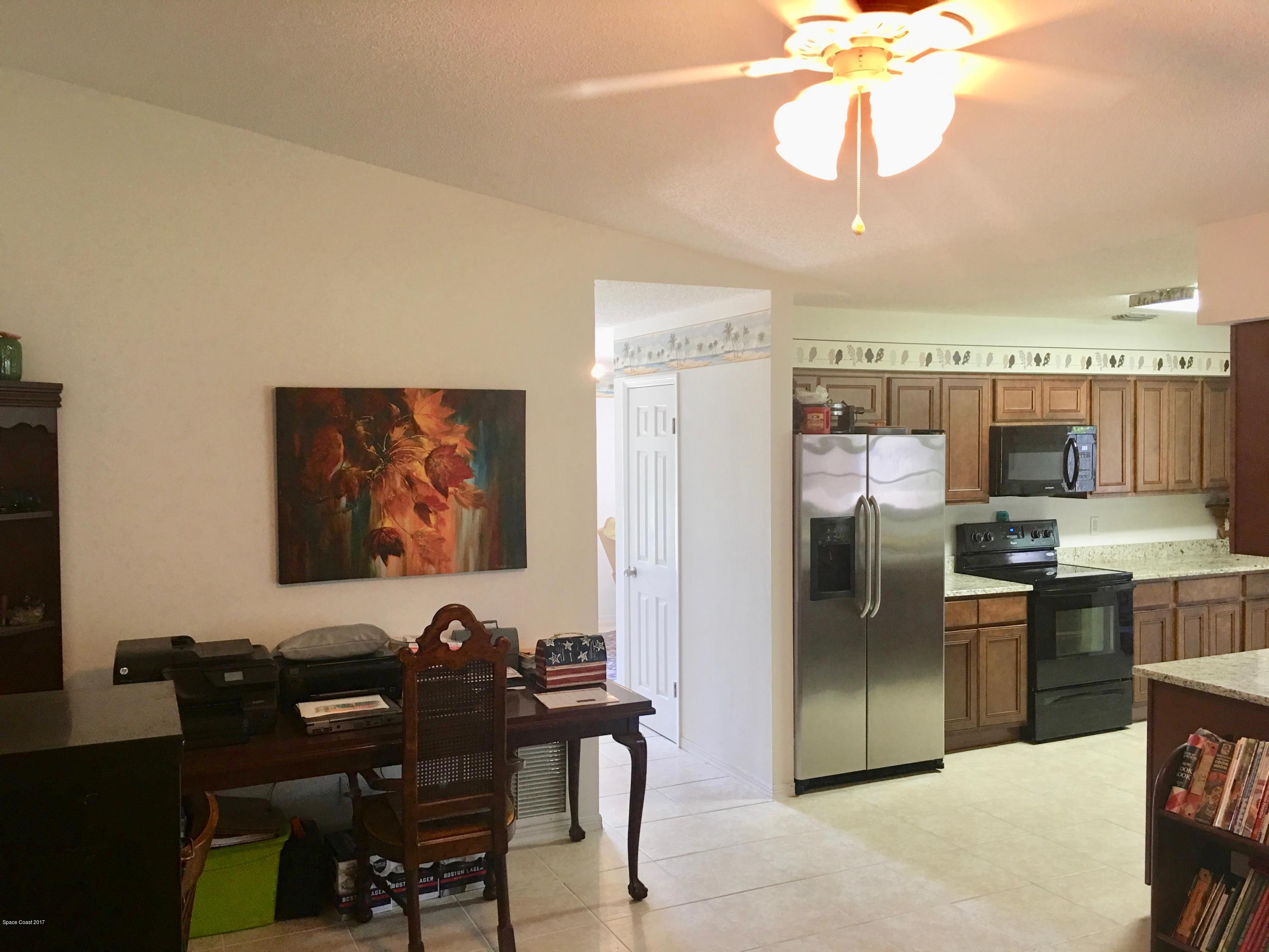 853 Furth Road Northwest Palm Bay, FL 32907 - Photo 9 of 29 a view of a dining room with furniture